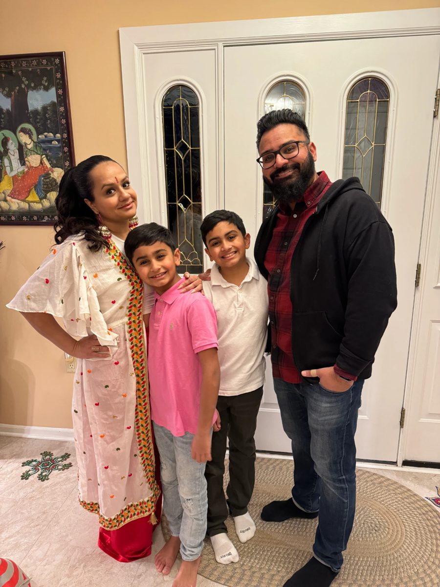 Aakesh Patel with his wife and two sons at home